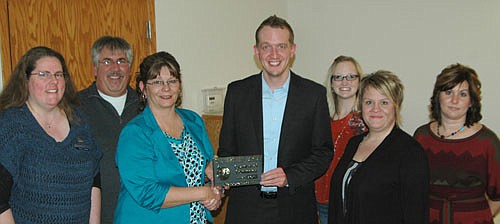 The Stewartville Area Chamber of Commerce welcomed Hampton Inn-South Broadway as a new Chamber member with an official Ambassador visit last week. Deann Stowers, Chamber president, third from left, presents Jim Sele of the Hampton Inn with a Chamber plaque. In front, from left, are Beth Jay and Erika Trempe of Hampton Inn. Other Chamber members include, in back, from lef<!--1up-20-->t, Mark Podein, past president; Melissa Sue Martin, Chamber administrator; and Lonnie Boe.