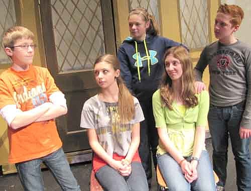 The townspeople of Hamelin look to the mayor (Nathan Onsgard), above far left, for a way to find the missing children during a rehearsal for Stewartville Middle School's upcoming production of The Pied Piper of Hamelin, to be presented at the Performing Arts Center this Friday and Saturday, Feb. 8 and 9 at 7 p.m. both evenings, and this Sunday, Feb. 10 at 2 p.m.  Townspeople include, seated, from left, Emily Majerus and Candi Quandt; and standing, from left, Olivia Waltman and Jack Wood.