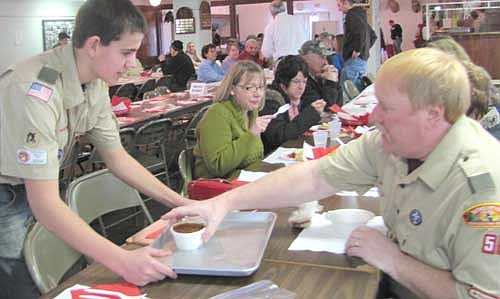 David Rysted, left, serves a bowl of chili to Alvin Horstmann at the annual Boy Scout Chili Feed at the Stewartville Sportsman's Club on Sunday, Feb. 3. 