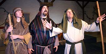 Travis Jorde as a shepherd, Gary Kadansky and Brian Alwin, another shepherd, marvel as the shepherds explain the heavenly host's announcement that the Messiah has been born. 