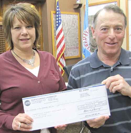 Theresa Whitcomb of People's Energy Cooperative presented a $2,500 check to Mayor Jimmie-John King at last week's Stewartville City Council meeting. The city plans to use the grant money to help pay for an initiative to establish more shovel-ready lots in the Schumann Business Park. "Thank you on behalf of the city," King told Whitcomb. "People's Co-op has always been a good partner with the city."