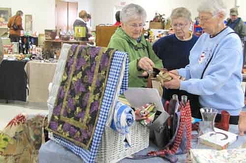 Hundreds of Stewartville and area residents attended the Stewartville Area Historical Society's annual Cabin Fever Flea Market at the Stewartville Civic Center on Saturday, Feb. 16. Vicki Meredith, president of the Historical Society, said that 30 vendors sold crafts, antiques, food, knickknacks, tools, wine racks, lawn ornaments and more from 54 tables. "It's fun," Meredith said. "Some of the same vendors are back, and you always get a few new ones. That's what makes it interesting." Above, from left, Ginny King, Nancy Momeny and Jan Lubahn look over a few items.