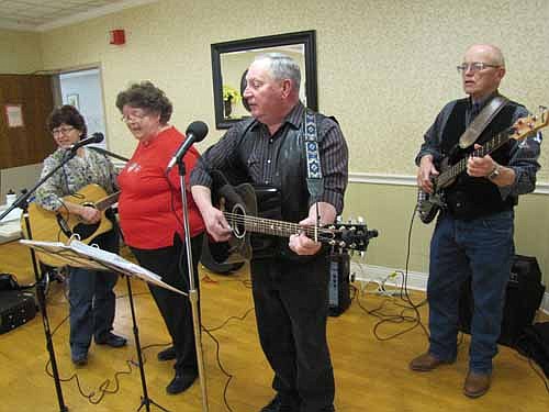 "Country at Heart" performed to a large audience at the Stewartville Care Center on Saturday, Feb. 16. The two women in the band are sisters of Twyla Hellickson, a resident of the Care Center who was in the audience for the performance.