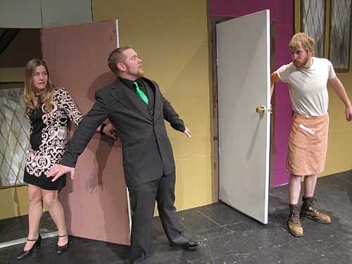 Ron (Jake Dreher), right, has fallen into the swimming pool while looking for his wife Jane (RaeAnn Gotch), left, who he mistakenly believes is having an affair with George (Nick Rudlong) center, in Stewartville Community Theatre's presentation of "Out of Order," a fast-paced British comedy.
