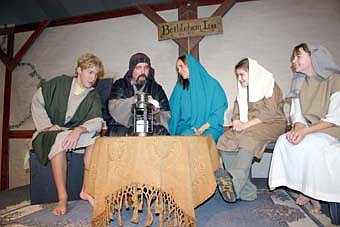 LIFE AT THE BETHLEHEM INN -- Hezekiah the Innkeeper, played by Gary Kadansky, second from left, explains a fine point to members of his family during a dress rehearsal for Grace Evangelical Free Church's upcoming performances of "Bethlehem Inn." Family members include, from left, Ben Raygor as Benjamin, Kadansky as Hezekiah, Kim Alwin as Hannah, Megan Alwin as a daughter and Carly Quam as a daughter. 