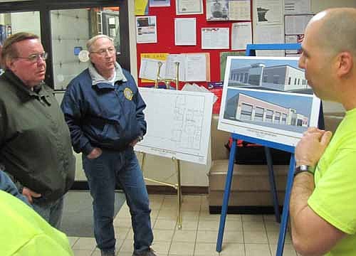 Vance Swisher, assistant fire chief for the Stewartville Fire Department, right, speaks to Stewartville residents, at left, from left, Virgil Clark and Tom Ranzenberger at an open house at the Stewartville Fire Hall on Tuesday evening, Feb. 26. The event gave residents a chance to ask questions about the Fire Department's proposal to build a new Fire Station.  Stewartville residents will decide whether to build the new facility in a referendum vote.