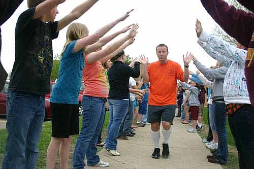 Jim Parry, who ran and walked for 100 miles in about 24 hours in 2010, gets encouragement from his students as he begins his Endurance Challenge that year.