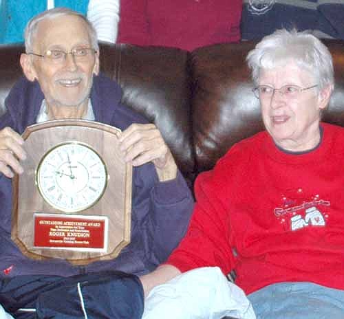 Roger Knutson Sr., joined by his wife Peggy, was presented the Stewartville Wrestling Booster Club's Outstanding Achievement Award on March 3.