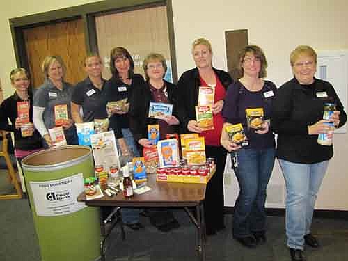 Eastwood Bank of Stewartville invites local and area residents to donate nonperishable food items at the bank through the end of March. The food will be donated to the Channel One Food Bank, which serves 14 counties in southeastern Minnesota and La Crosse County in Wisconsin. Channel One needs canned meats and fish, canned fruits and vegetables, boxed meals and soups, baking goods, gluten-free items, hygiene products and beans, cereal and rice. Eastwood Bank employees, from left, include Heather Burns-Myhre, Ann Lutteke, Beth Schmidt, Kim Brown, Sharon Theobald, Katie Lund, Heather Ludemann and Deb Zeimet.