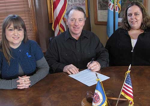 About two weeks ago, Mayor Jimmie-John King signed a proclamation declaring April "Child Abuse Prevention Month" in Stewartville. The mayor is flanked by Allison Johnson, a lead social worker at the Olmsted County Child Resource and Referral Crisis Nursery, left; and Sonja Risley, a social work intern.