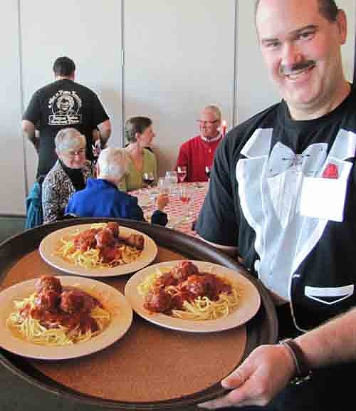 Jim Otto is one of the many waiters who served spaghetti and meatballs at the Mama Tranchita Spaghetti Dinner.  Members of the St. Bernard's Men's Club sold 566 advanced tickets to the event and served about 120 more guests who bought tickets at the door.