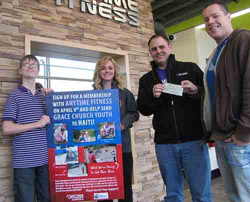 Todd Looney, general manager of Anytime Fitness of Stewartville, right center, presents a $320 check from the business to Andrew Langseth, pastor of Grace Evangelical Free Church, who will use the money to help pay for the church Youth Group's missionary trip to Haiti June 10-19. Sixteen students and chaperones, including Cole Hintz, left, and Chloe Kidd, will build a home, visit an orphanage and work to improve infant nutrition.