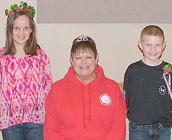 The Stewartville American Legion Auxiliary Unit #164 met on Monday,  April 15 for their regular meeting and crowning of the poppy queen, princess and prince. Pictured from left is Brianna Ramaker, poppy princess; Peggy Paulson, poppy queen, and Timothy Swenson, Jr., poppy prince. The three will be in the Memorial Day parade and Fourth of July parade representing Stewartville American Legion Post #164 and Auxiliary.