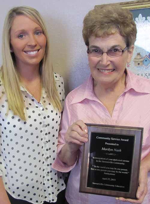 Marilyn Nash, right, accepts the Community Service Advisory Council's Community Service Recognition Award from Hailey Johnson, community education director for the Stewartville School District.