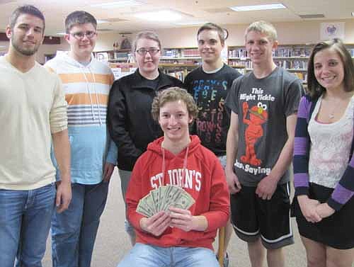 The Stewartville High School Student Council honored SHS students with cash awards at an Academic Pepfest on Friday, April 19. Matthew Terhaar, president of the Student Council, handed out the money at the SHS library media center last week. Recipients include, from left, Matt Aldrich, Sam Edge, Brooke Hilger, Joe Hanscom, Josh Wilson and Jocelyn Helget. Paige Tapp, another recipient, wasn't available when the photo was taken. Edge, Tapp and Hilger received $300 each in a drawing among students with a 4.0 grade point average. Aldrich and Hanscom received $300 each in a drawing among "A" honor roll students. Wilson and Helget received $50 each in a drawing among "Most Improved" students.