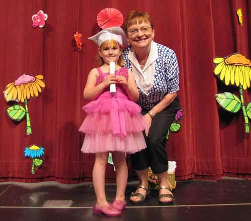 Stewartville Early Childhood Family Education (SECFE) held its School Readiness graduation ceremony at the Stewartville High School Performing Arts Center on Wednesday, May 22. Here, Nancy Pedersen, an early childhood teacher, poses with graduate Katie Berge.