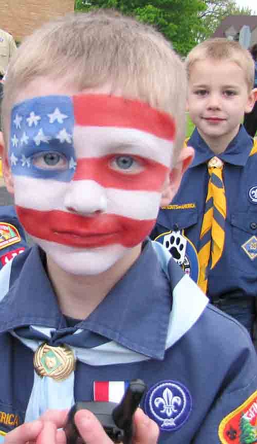 Alex Colligan of Cub Scout Pack 156 wears his love for the United States on his face as he waits for the start of the Memorial Day Parade near Griffin-Gray Funeral Home on Monday morning, May 27.