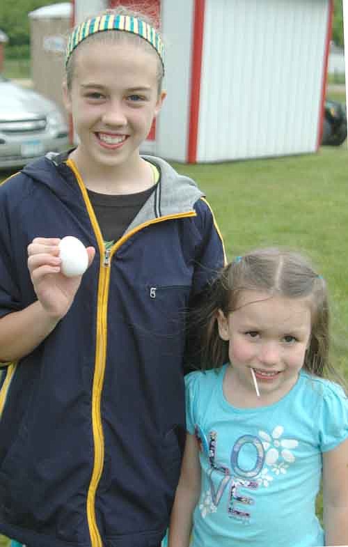 JoJo Welter, left, and Eva Biffert teamed up to win both egg toss contests at this year's Old Settlers Day.