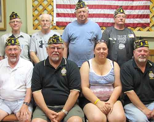 The Stewartville American Legion Post 164's officers for 2013-14 were installed at a meeting at the Legion on Monday, June 17. They include, front row, from left, Dave Nystuen, first vice commander; Richard Paulson, commander; Kristin Anderson, historian; and Thom Blade, second vice commander. Back row, from left, Roger Barsness, adjutant; Dennis Voll, sergeant at arms; Dick Moehnke, chaplain; and Greg Olson, judge advocate.