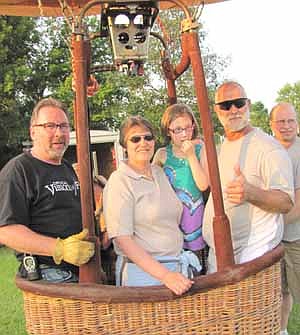 Above, from left, Michael Lesmeister, Virginia Sass, Natalie Weber and Owen Sass are ready to take flight. John Kellner stands at far right 