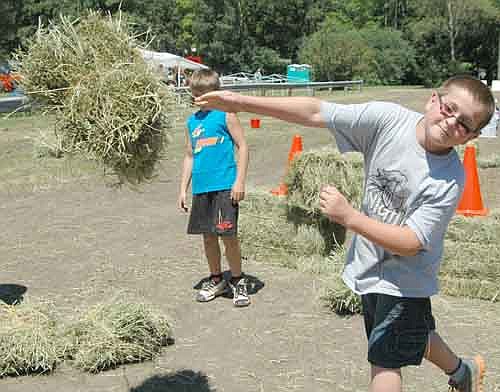 Hunter Lee, 10, of Spring Valley, threw a bale of hay 34'7" at the Root River Antique Historical Power Association Antique Engine & Tractor Show on Friday afternoon, July 19.