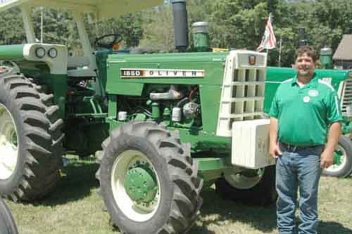 Bryan Vrieze of Racine stands near one of the six Oliver tractors he brought to this year's Root River Antique Historical Power Association Antique Engine & Tractor Show south of Racine on July 19-21. Vrieze grew up on a dairy farm near Racine, where his dad owned three Oliver 88 tractors. Now, years later, Bryan's brother Ron has nine Olivers on hand to work the same farm with his son, Craig. "(Olivers) are what I grew up with," Bryan said.