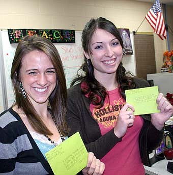 WORDS OF GRATITUDE -- When Bruce Hoff, Stewartville High School principal, suggested writing letters to wounded U.S. soldiers, Erika Sahl, left, Andrea Hogan and other SHS Student Council  members responded by completing 80 letters. 