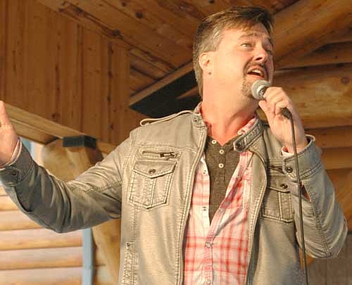 Mark Smeby, a Christian singer-songwriter, right, performs at Ironwood Springs Christian Ranch on July 27.