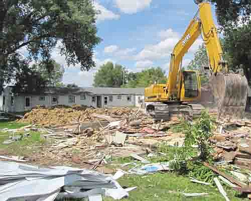 Work crews demolished the cabin apartments along Main Street last week. Podein's Power Equipment, located just south of the cabins, plans to expand its business onto the site where the cabins have stood for many years.