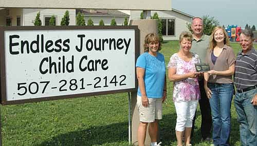 The Stewartville Area Chamber of Commerce welcomed Endless Journey Child Care to the local business community with a recent ambassador visit. Melissa Sue Martin, Chamber administrator, second from right, presents a Chamber plaque to Vicky Pagel, owner of Endless Journey Child Care. Kathy Stolhanske, director of Endless Journey, is at far left. Other Chamber members include Bill Schimmel Jr., in back, and Jimmie-John King, right, both representing the city of Stewartville.