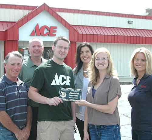 The Stewartville Area Chamber of Commerce welcomed Tiger Ace Hardware to the local business community with a recent ambassador visit. Melissa Sue Martin, Chamber administrator, second from right, presents a Chamber plaque to Sean Redmond of Tiger Ace Hardware. Other Chamber members include, from left, Jimmie-John King, Bill Schimmel Jr., Margaret Nelson and Beth Schmitt.