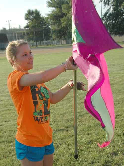 Anya Raygor of the Stewartville High School Band's Color Guard practices her routine at SHS Band Camp last week.