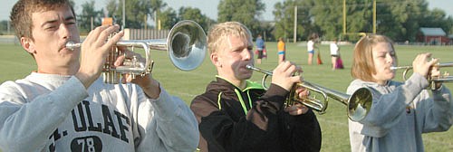 A TUNE ON THE TRUMPET  -- From left, trumpet players Josh Rupprecht, Josh Wilson and Shannon Onsgard work on their skills.