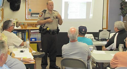 Sgt. Chad Dauffenbach of the Minnesota State Patrol reviewed safety procedures with 27 bus drivers from Grisim School Bus, Inc. last week. Drivers from Grisim Bus receive 20 to 25 hours of safety training per year, well beyond the mandatory eight hours of training, said Connie Grisim, co-owner of Grisim School Bus. Dauffenbach meets with Grisim's drivers before the start of the school year each year to refresh the drivers on the fundamentals.