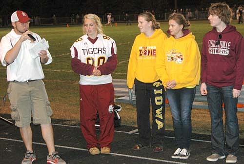 Byron High School won the closely contested battle of the texts with Stewartville High School during the week leading up to SHS's homecoming football game on Friday, Sept. 20. The It Can Wait texting contest was held to encourage students from both schools not to text and drive. The SHS Key Club and Student Council promoted the event. Steve Nelson, Key Club advisor, at left above, speaks at halftime of the homecoming football game as Key Club members, from left, Jessica Rosenblad, Haley Ahart, Kaitlyn Claeys and Isaiah Grafe look on.
