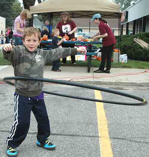Broc Mullenbach, a first-grader at Bonner Elementary School, displays his skill with a Hula-Hoop at the Stewartville Morning Lions Club's annual Fall Festival on Saturday, Sept. 28.