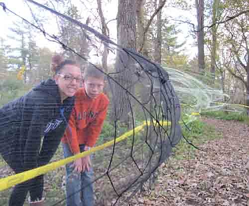 Jade Schmeling, a freshman at St. Louis Park High School, left, and her cousin Gabe Nelson, a seventh grader at Stewartville Middle School, hosted the second annual "Spook City in the Woods" in rural Racine last Friday, Oct. 18 and Saturday, Oct. 19. Guests walked through a sectioned-off path of woods decorated with spider webs, graveyards, skeletons and more. All proceeds from the event were donated to Pacer's National Bullying Prevention Center.