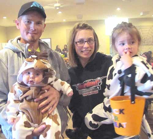  Jared Groski and Alexa Weiss and children Keira, 3 months; and Addison, 2 years, joined hundreds of others who attended the annual Halloween party at the Stewartville American Legion Post 164 last Thursday, Oct. 31. Keira dressed as a pony and Addison came as a cow.