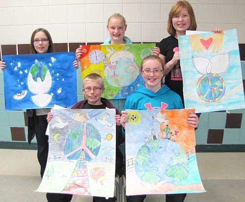 Stewartville Middle School sixth graders who won awards in the annual Stewartville Lions Club Peace Poster contest include, front row, from left, Gabriel Jones, first place, $50; and Emilie Rupprecht, second place, $25. Back row, from left, Kayla Meyer, honorable mention; Bella Kruger, third place, $15; and Domonique Thomley, honorable mention. All the participants earned certificates for their efforts. Gabriel now advances to take part in the Lions District 5M1 regional contest to be held at the Clarion Hotel in Rochester on Sunday, Dec. 15. The first-place winner at the regional contest will win $500. For more information about the Peace Poster contest, see interviews with four contestants in "Street Beat" on today's Editorial Page.