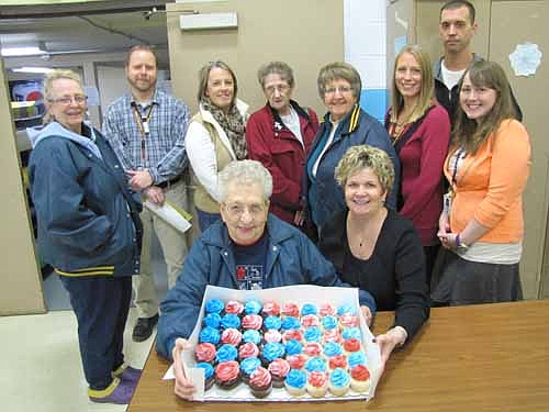 Members of the Stewartville American Legion Auxiliary Unit 164 celebrated American Education Week last week by delivering cupcakes to Central Intermediate School, above; Bonner Elementary School, Stewartville High School and Stewartville Middle School. Front row, from left, are Viny Byrne and Cheryl Roeder, Legion Auxiliary members. Standing in back are, from left, Carole Kiehne of the Legion Auxiliary, Zane McInroy, fourth-grade teacher; Judy Schroeder, Carol Chihak and Sharon Moehnke of the Legion Auxiliary; Tyne Winn, Central art teacher; along with Jeff Jacobsen and Brooke Haling, fifth-grade teachers.