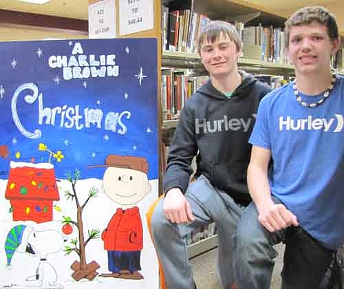 Colton Mason, left, and Kurtis Keller, juniors at Stewartville High School, earned the top prize in the Winterfest life-sized Christmas card contest with their drawing, "A Charlie Brown Christmas."