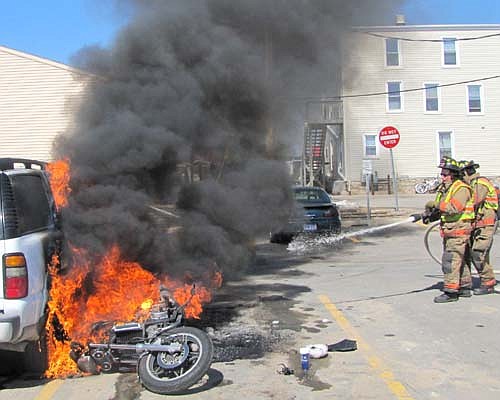 News highlights through the lens of the Stewartville STAR's cameras from the first half of 2013 included local firefighters responding to a motorcycle that caught on fire and fell toward a Chevrolet Tahoe at the parking lot west of Sammy's Family Restaurant on Wednesday, April 3.