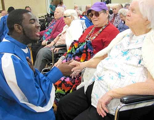 News highlights through the lens of the Stewartville STAR's cameras from the first half of 2013 included a member of the Rust College A'Cappella Choir shaking hands with Bea Raygor at the Stewartville Care Center on Tuesday, April 23.