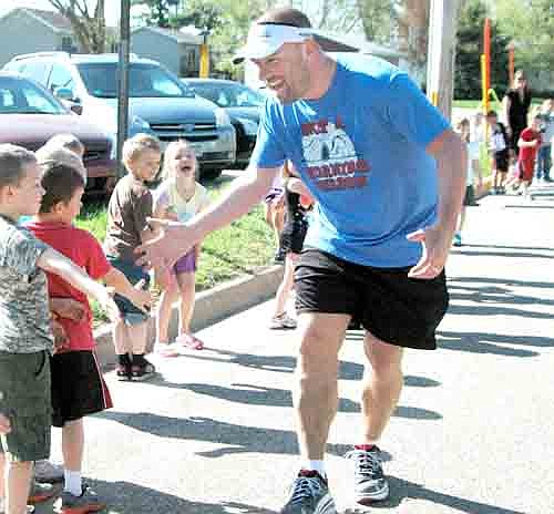 News highlights through the lens of the Stewartville STAR's cameras from the first half of 2013 included Jim Parry, beginning another 24-hour Endurance Challenge, draws encouragement from students at Bonner Elementary School on May 16.