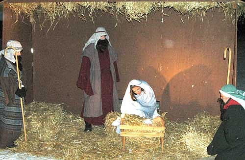 Drivers in a long and steady line drove through the parking lot at Grace Evangelical Free Church to see the second annual Live Nativity on Saturday evening, Dec. 14.  About 60 young people from a number of area churches took part.