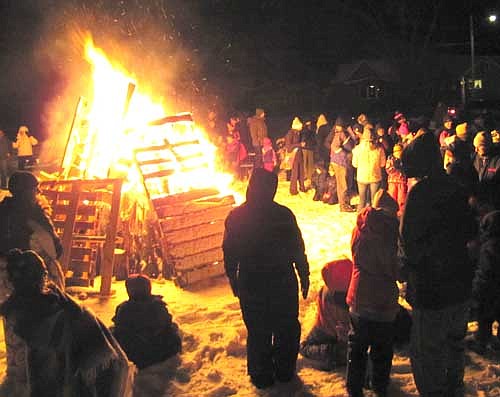 Scores of Stewartville and area residents found warmth near the bonfire at Florence Park on Saturday evening, Dec. 14.