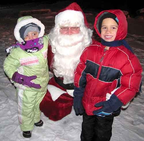 Schanielle Hayes, 3, left, and Dayton Hayes, 5, right, dressed warmly for their meeting with Santa Claus at Winterfest on Saturday evening, Dec. 14.
