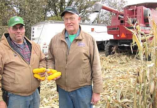 Farmers Ed Twohey, left, and his dad Frank were pleasantly surprised by their corn yields in late October.