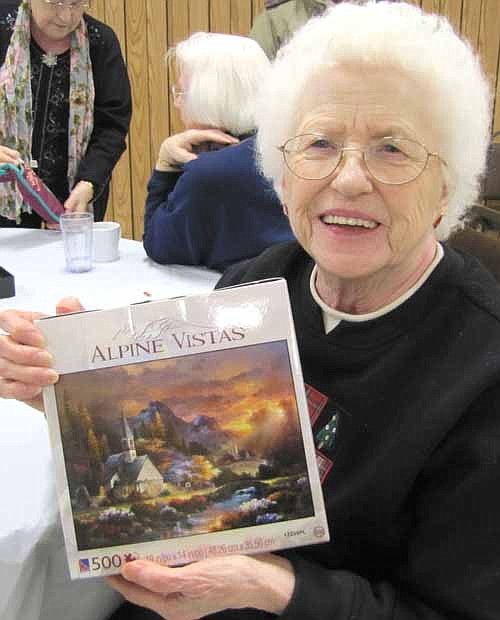 Dorothy Sloneker of Stewartville won a 500-piece Alpine Vistas puzzle at the Christmas party at the Center for Active Adults on Tuesday, Dec. 17.