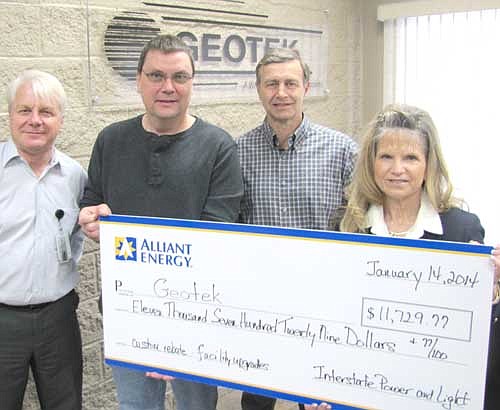 Geotek of Stewartville has been honored for taking a number of steps to save energy. Rebecca Gisel, key account manager for Alliant Energy, right, presented Geotek representatives with a check for $11,729.77 last week to thank the company for installing energy-efficient lighting and air conditioning and for putting in occupancy sensors for its lighting. The changes will save Geotek $6,000 per year in energy costs and 95,000 kilowatt hours of electricity per year, Gisel said. Geotek executives, from left, include Don Dalland, vice president of operations; Shawn Murphy, facilities manager and Dale Nordquist, president.